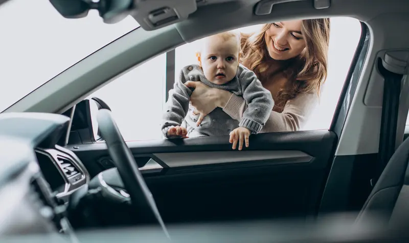 family viewing new car